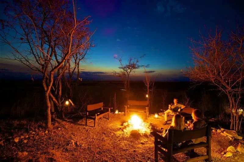 Couple at a campfire on a Tanzania romantic safari
